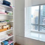 Custom white bay window storage cabinet and shelving unit built-in bedroom Singapore direct carpentry