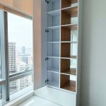 Custom open door wardrobe cabinet with warm wood shelving inserts direct carpentry Singapore