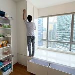Direct carpenter installing custom glossy white bay window wardrobe cabinet in Singapore HDB or condo